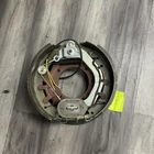 Lippert 297998 Electric Brake Assembly, 12.25" X 5"; 12,000 Lbs. Left Side Used. Price: $100.00.